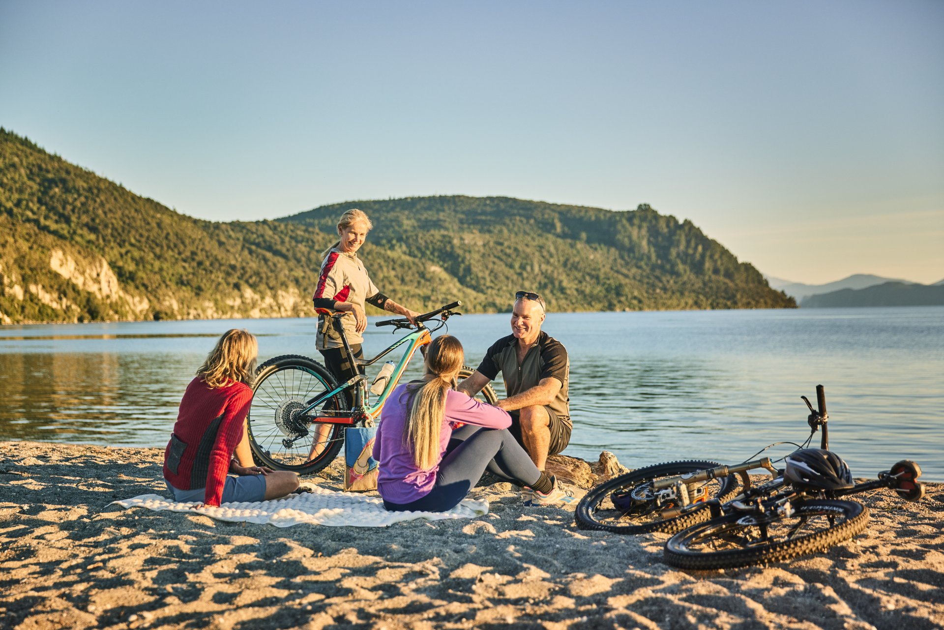 Friends mountain biking - Sunset picnic at Kinloch - by Todd Eyre