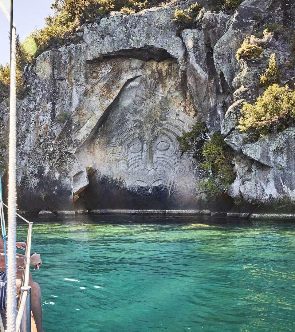 Family sailing cruise at Ngātoroirangi Mine May Māori Rock Carvings in Lake Taupō - Kindred Spirit - by Todd Eyre