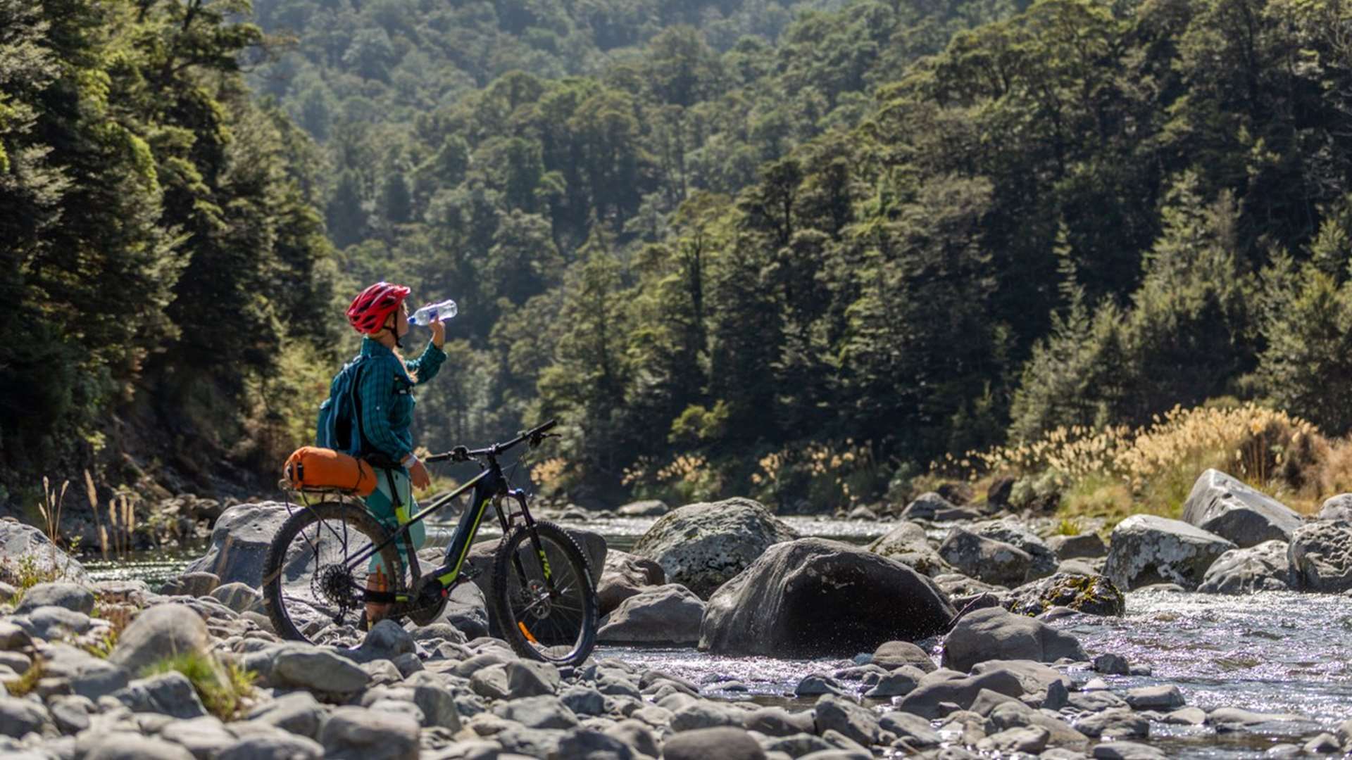 Woman riding Tongariro River Trail